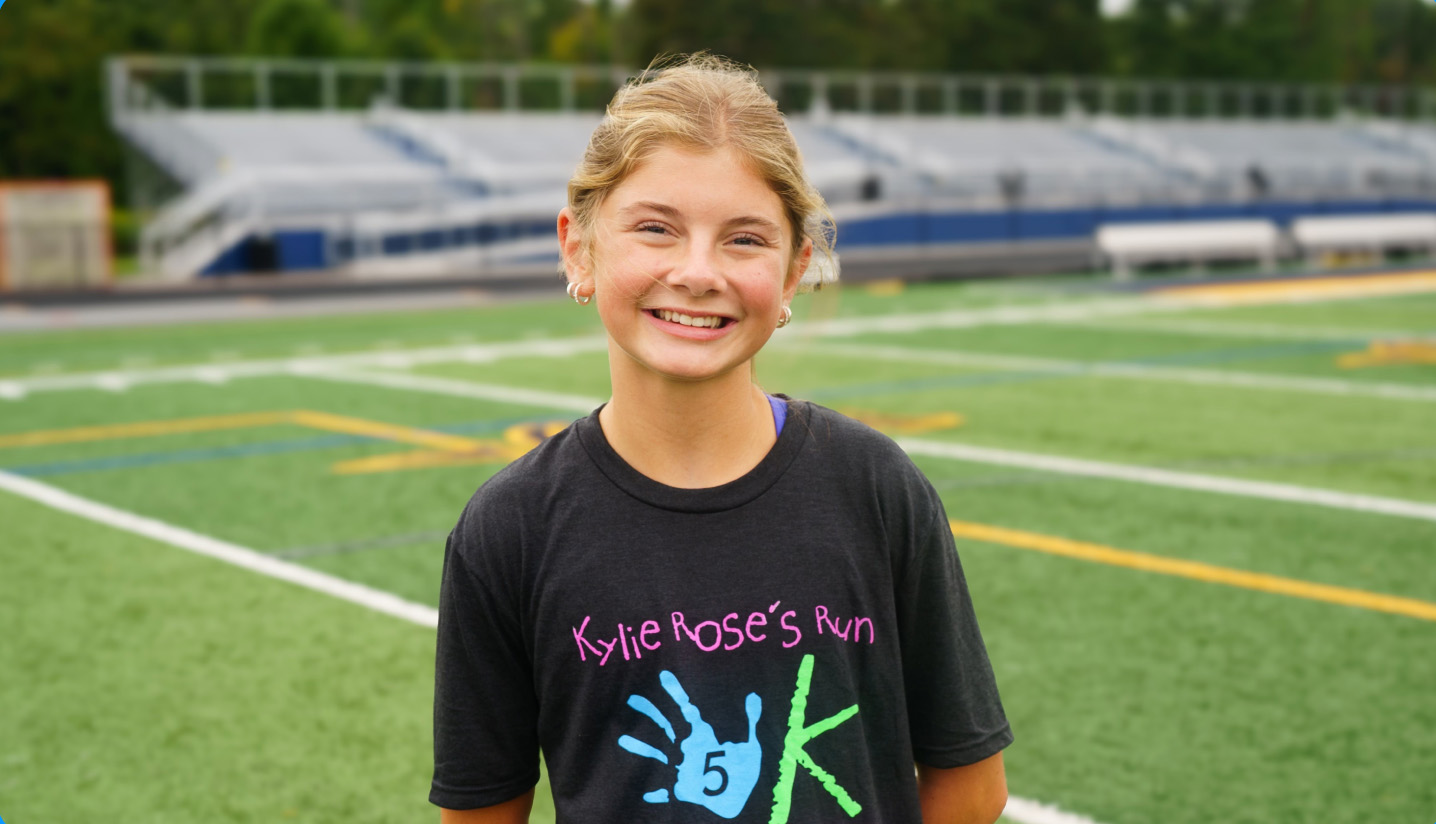 Image of teen female on football field