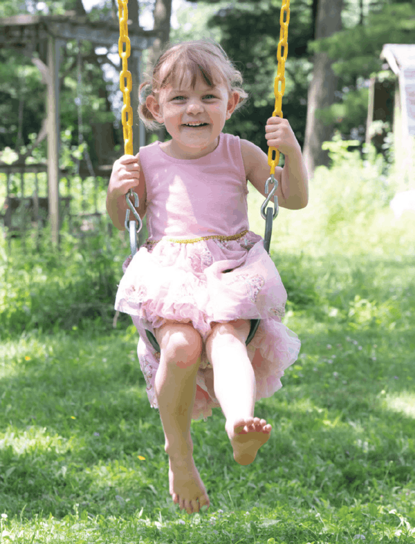 More Childhood Please Magazine - Girl in pink on swing