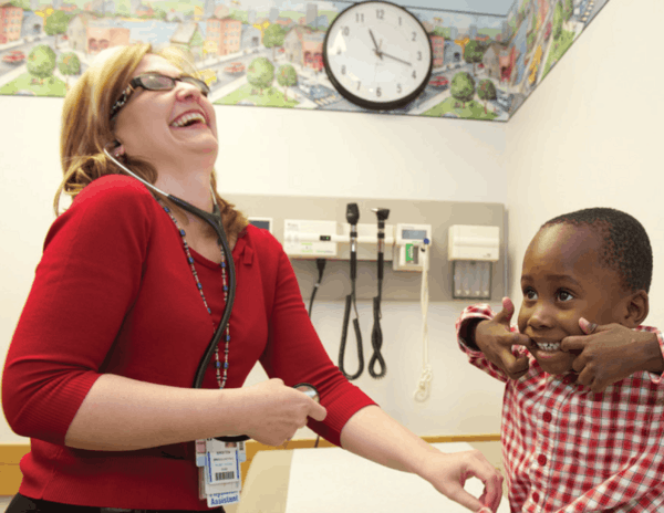 More Childhood Please Magazine - Woman with boy laughin