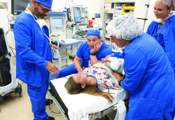 More Childhood Please Magazine - Doctors talking to pat