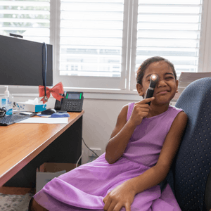 Featured Image for School age black girl with otoscope