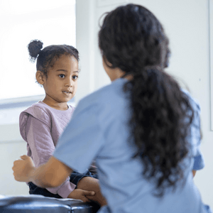 Featured Image for Young girl with healthcare worker