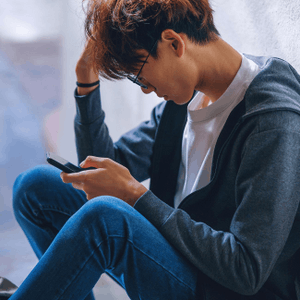 Featured Image for Asian teen scrolling