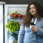 How families can combat the obesity epidemic GettyImages-girl in front of refrigerator