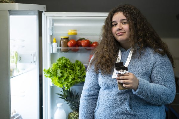 GettyImages-girl in front of refrigerator