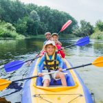 Family kayaking on the river