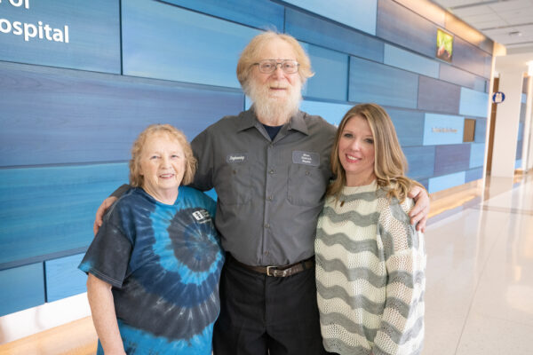 Barry Nolf with Vicki, his wife, and Jennifer Henley, granddaughter, who also work at Children's