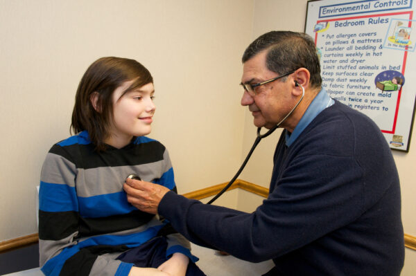 Dr. Rajeev Kishore shown with a patient