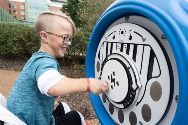 Patient plays at Akron Children's inclusive playground