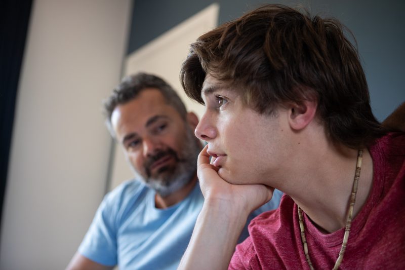 GettyImages - teen boy talking to dad