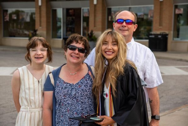 Melaina Uhrig and her family at her high school graduation 