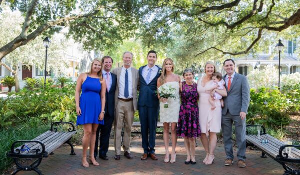 Dr Kelsey Brocker and husband at their wedding with siblings and parents