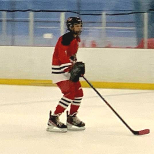 Elliott Hannah playing hockey