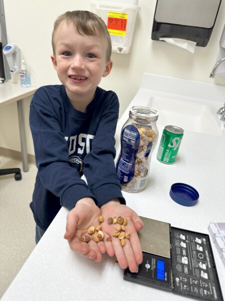 Harrison Huntington shows peanuts at Akron Children's allergy appointment