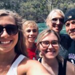 Family uses movement to help with mitochondrial symptoms The Paluch family poses for a selfie.
