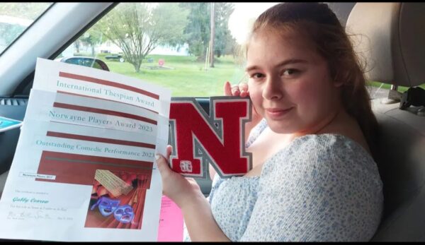 Gabby Conrow shows high school book 