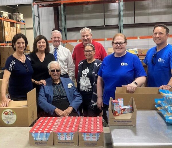 Dr Elena Rossi and dad-food bank donation