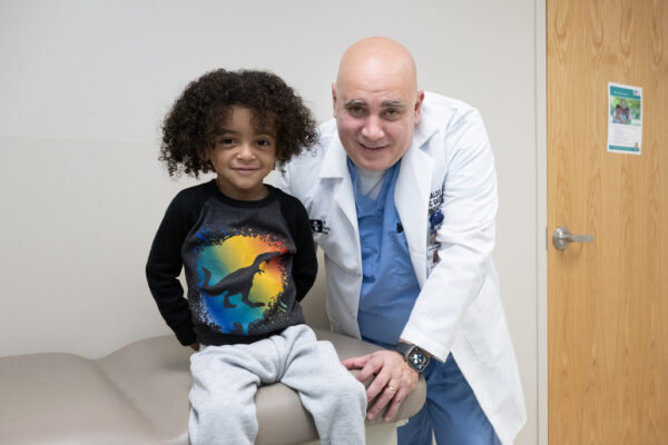 Dr. Reinaldo Garcia examines his patient Bryson Proctor