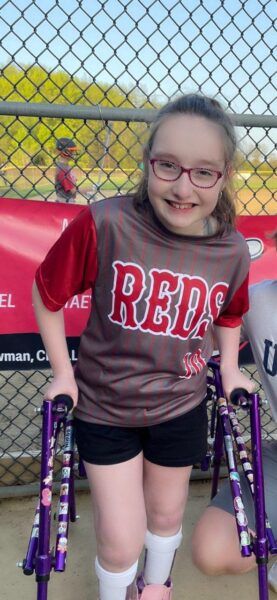 Alexis Walsh is pictured in her baseball uniform