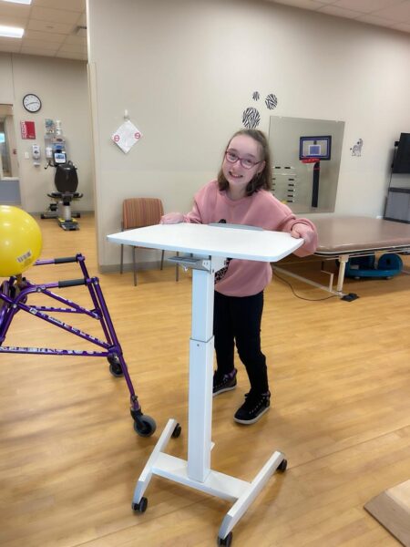 Alexis Walsh is shown at a physical therapy session