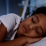 Springing forward: Tips for a restful transition adorable african american kid sleeping in bed at home