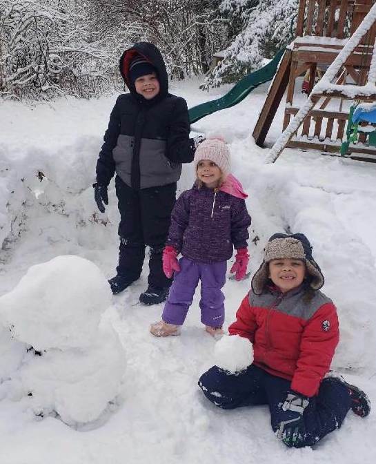 Ezra in front with brother Jude and sister Thea