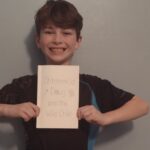 An emergency visit for stitches inspires the story of ‘Stitch’em Up Doug and the Wild Child’ Tristan Rhoades holding a copy of "Stitch'em Up Doug and the Wild Child'