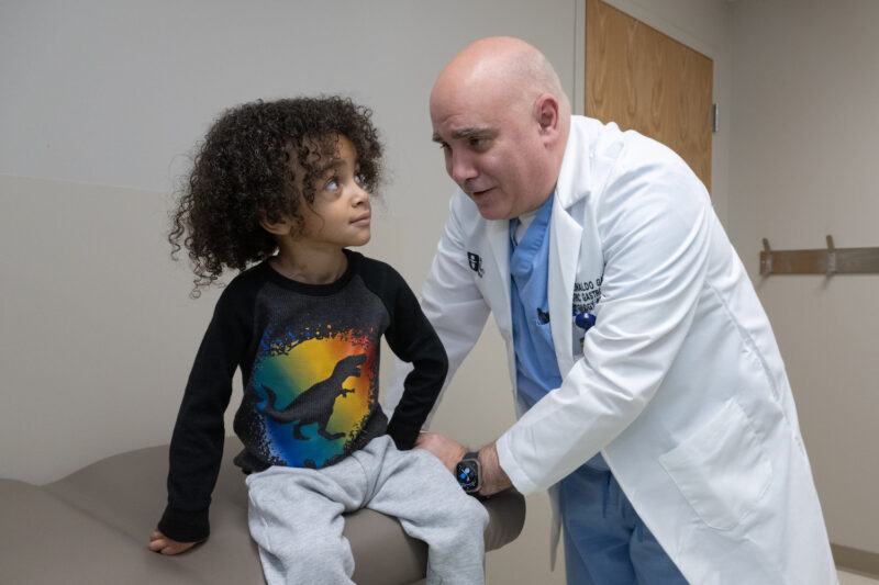 Dr. Reinaldo Garcia-Naveiro, director of Pediartric Gastroenterology with patient Bryson Proctor