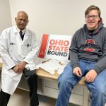 Ian Cadwallader and Dr. Patel OSU sign
