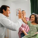 Getty - doctor high fiving patient