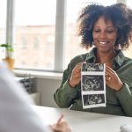 Getty Image - mom with ultrasound images