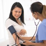 Six ways to plan for pregnancy when you have a preexisting condition GettyImages - pregnant woman blood pressure