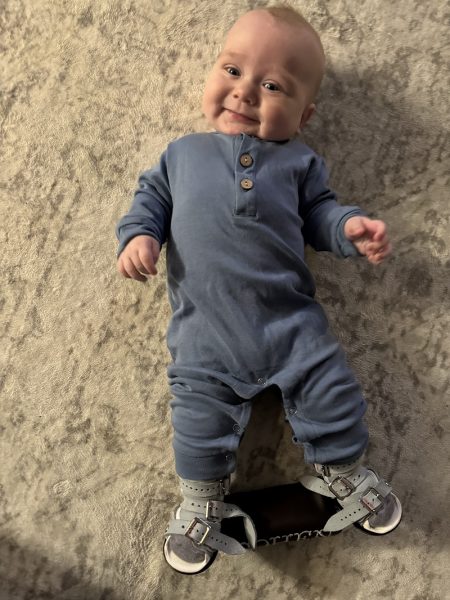 Cohen Bisbal smililng on floor