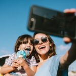 Learn about ‘mommymaxxing’ and reducing mental overload GettyImages - mom and daugther selfie