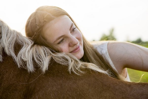 GettyImages-girl hugging horse resized