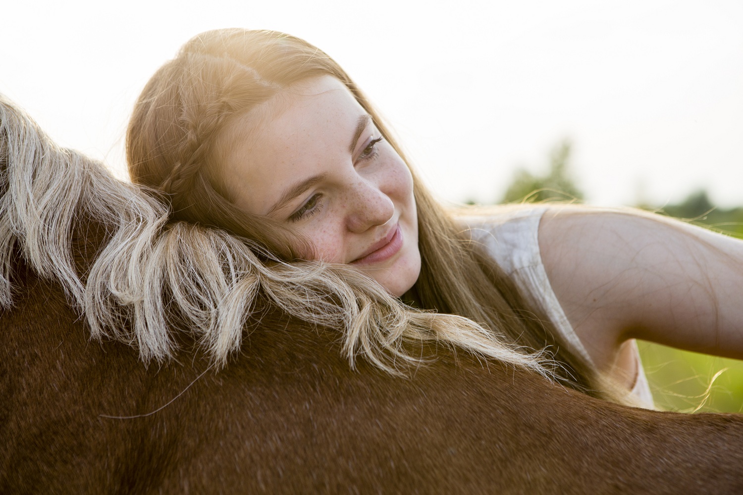 GettyImages-girl hugging horse resized