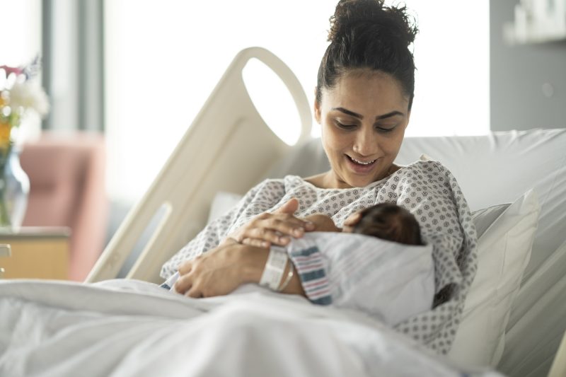 GettyImages-mom looking at newborn