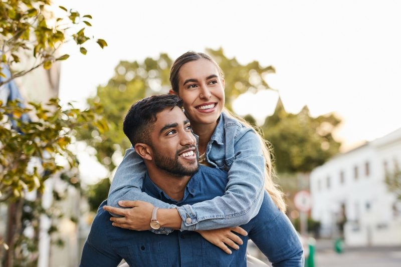 Young couple piggyback -resized for blog