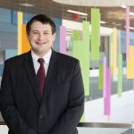 Patient experience spotlight: Dr. Christopher Costin Dr. Christopher Costin smiling at the camera is a black suit and red tie in the Kay Jeweler’s Pavilion on the Akron Children’s Golisano Campus.